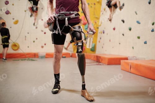 Preview: Low section of man with robotic leg in gym