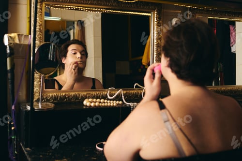 Preview: Drag queen embodies elegance while preparing for a dazzling holiday show backstage