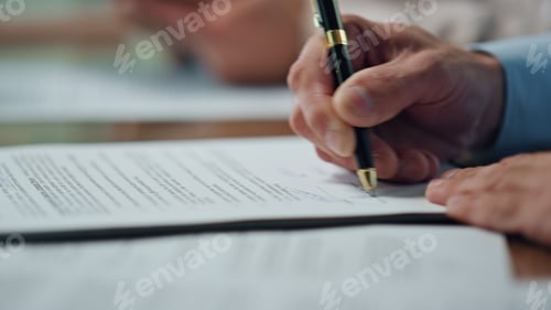 Preview: Businessman hand signing agreement negotiation table. Happy employee satisfied