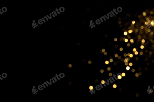 Preview: Golden blurred bokeh lights on black background