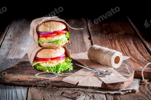 Preview: Closeup of tasty burger with egg to takeaway