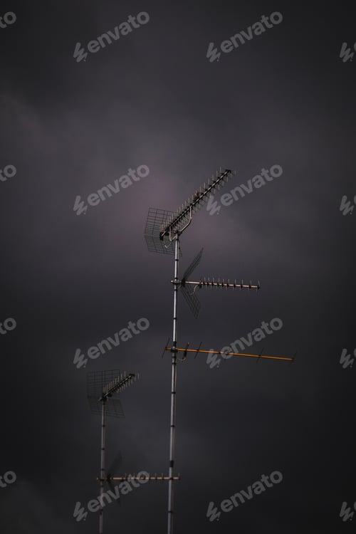 Preview: Vertical shot of an antenna in the stormy weather