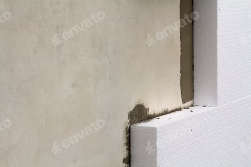 Preview: Close-up detail of plastered house wall with rigid styrofoam insulation. Modern technology
