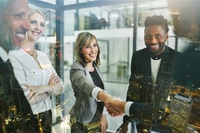 Preview: Business People Shaking Hands With City Night View