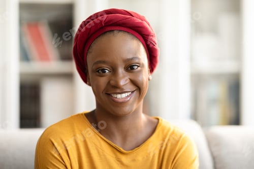 Preview: Portrait of pretty young black woman posing at home