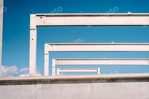 Preview: Construction site with precast cement pillars and beams