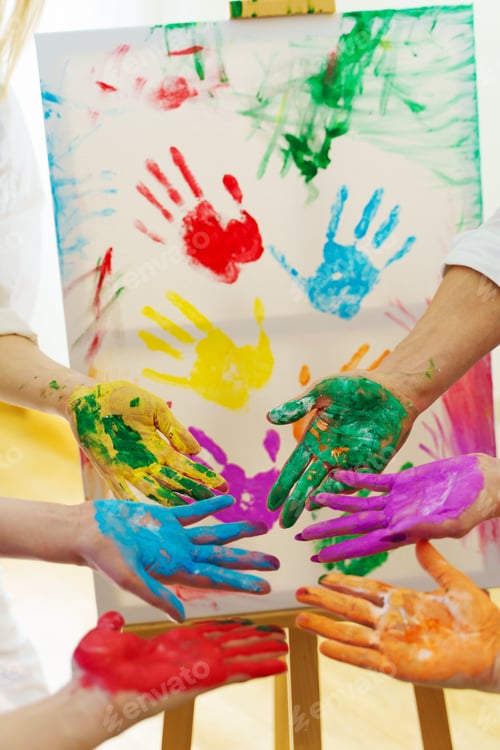 Preview: Female palms in colorful rainbow paint colors creating modern artwork to support LGBT community