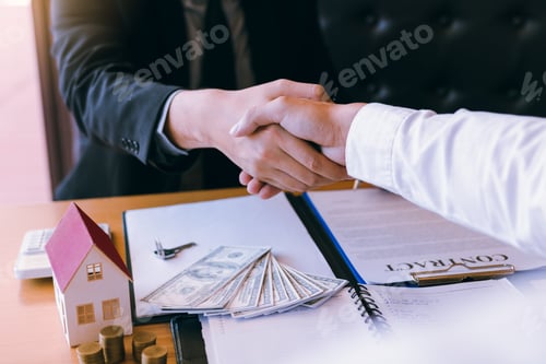 Preview: Home sales agents and buyers work on signing new homes and shaking hands.