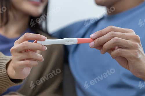 Preview: Couple Holding Positive Pregnancy Test