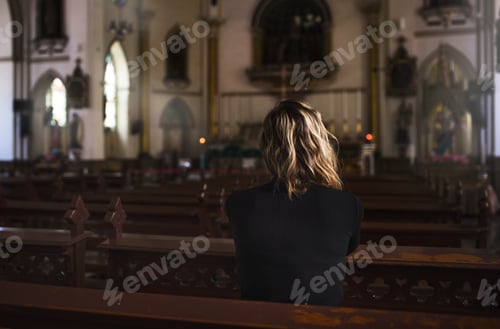 Preview: Woman praying in the church