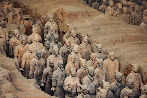 Preview: Terracotta Warriors in rows within a clay excavation site in Xi'an, China.