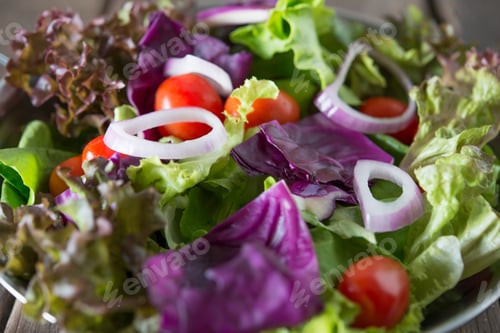 Preview: Fresh vegetables salad in the bowl with rustic old wooden background. Healthy food concept.