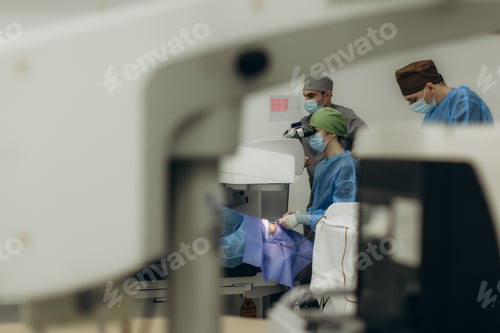 Preview: Surgeons performing laser eye surgery in operating room