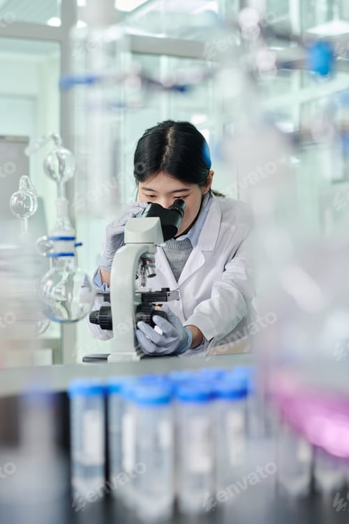 Preview: Woman studying new chemical substance