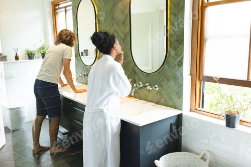 Preview: A diverse couple is in a bright bathroom