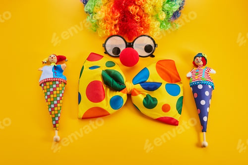 Preview: April Fool's day concept. Clown on yellow background