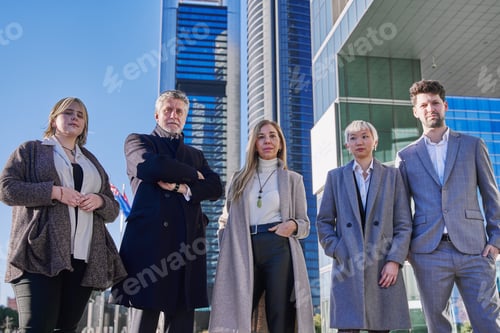 Preview: group of businessmen looking at camera with office buildings in background.