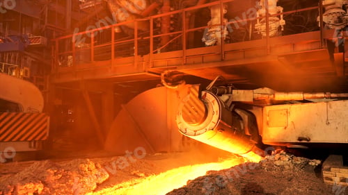 Preview: Side view of melting steel furnace big moving element in the hot foundry, metallurgy concept. Stock