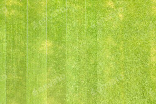 Preview: Close up aerial view of surface of green freshly cut grass on football stadium in summer.