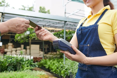 Preview: Plant Nursery Worker Accepting Payment