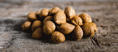 Preview: Almonds in shell on a Wooden Table