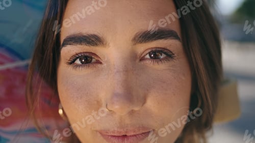 Preview: Portrait teenage skater posing skate urban settings. Woman face looking camera