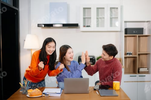 Vista previa: Teamwork and creativity with young adults collaborating on laptops and tablets