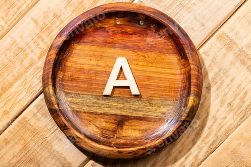 Preview: Letter A of the alphabet in a wooden bowl