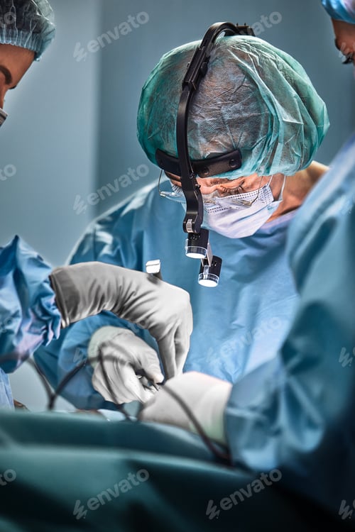 Preview: In the hospital operating room. An international team of professional surgeons and assistants works