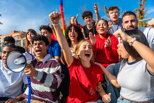 Preview: Diverse young people protesting together holding megaphone