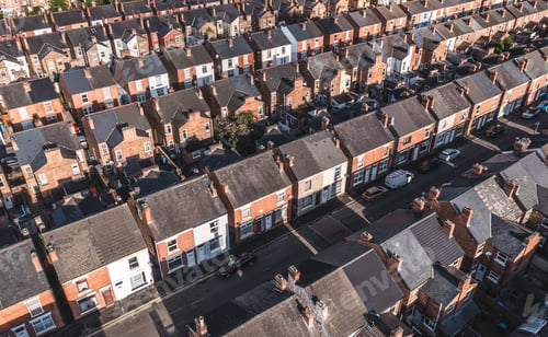 Preview: Aerial view above rows of back to back terraced houses on a large council estate