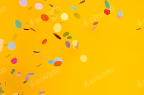 Preview: Colorful of confetti on gold background. Brilliant colored sequins. Holiday greeting card.
