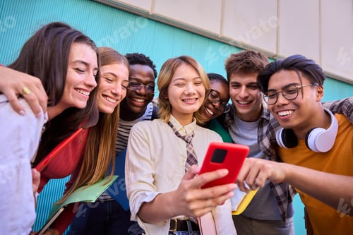 Preview: Group of young international university students smile happily watching funny video