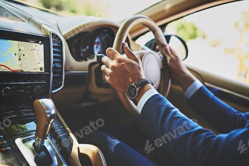 Preview: Shot of a unrecognizable businessman driving in his car on his way to work