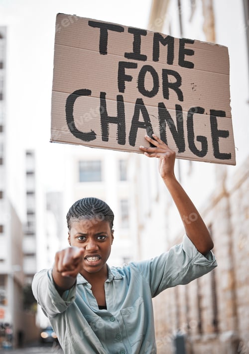 Preview: Women are leaders everywhere you look. Shot of a young woman protesting in the city.