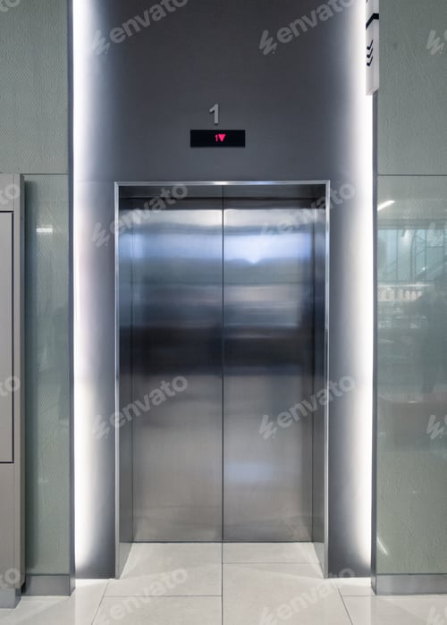Preview: Closed elevator doors glossy illuminated in hotel