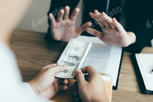 Preview: Businessperson refusing bribe given money by partner with anti bribery corruption concept.
