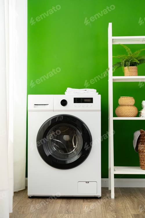 Preview: Modern white washing machine close up photo