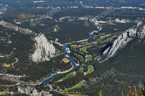 Preview: Aerial view of the Bow River surrounded by green vegetation. Banff National Park, Canada.
