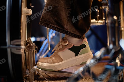Preview: Foot of Woman in Sneakers Hitting Bass Drum Pedal while Playing Rock Music in Studio