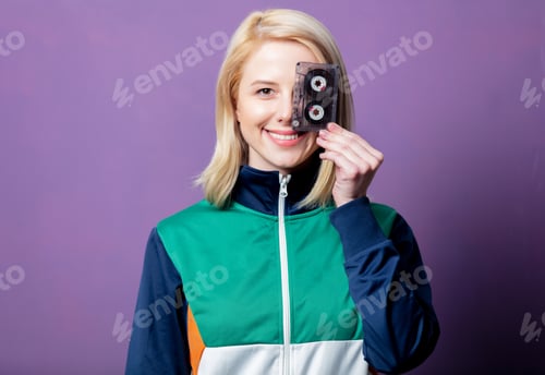 Preview: Style blonde woman in 80s clothes with tape cassette