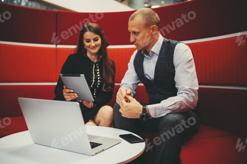 Preview: Two business colleagues with gadgets
