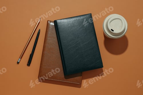 Preview: Black and brown notebooks with a cup of coffee