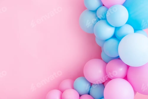 Preview: Blue and pink balloons on a pink background with copy space.