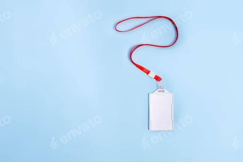 Preview: Empty Plastic Name Badge Holder With Strap Isolated On Blue Surface