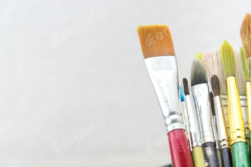 Preview: Group of Used brush in bucket on grey background