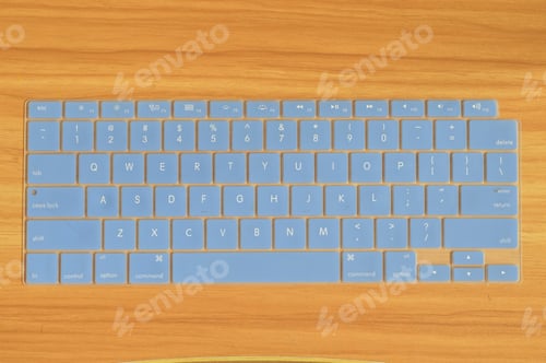 Preview: Keyboard silicone protector cover for laptop isolated on a wooden background