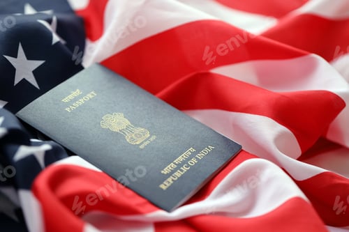 Preview: Blue Indian passport on United States national flag background close up