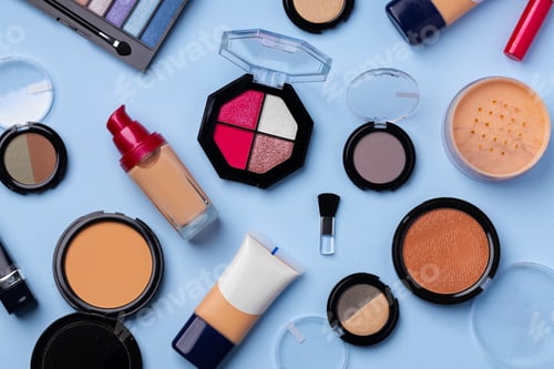 Preview: Complexion make up products and brush on blue background