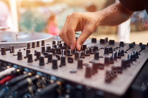 Preview: Close up of a DJ playing music on the outdoor party.